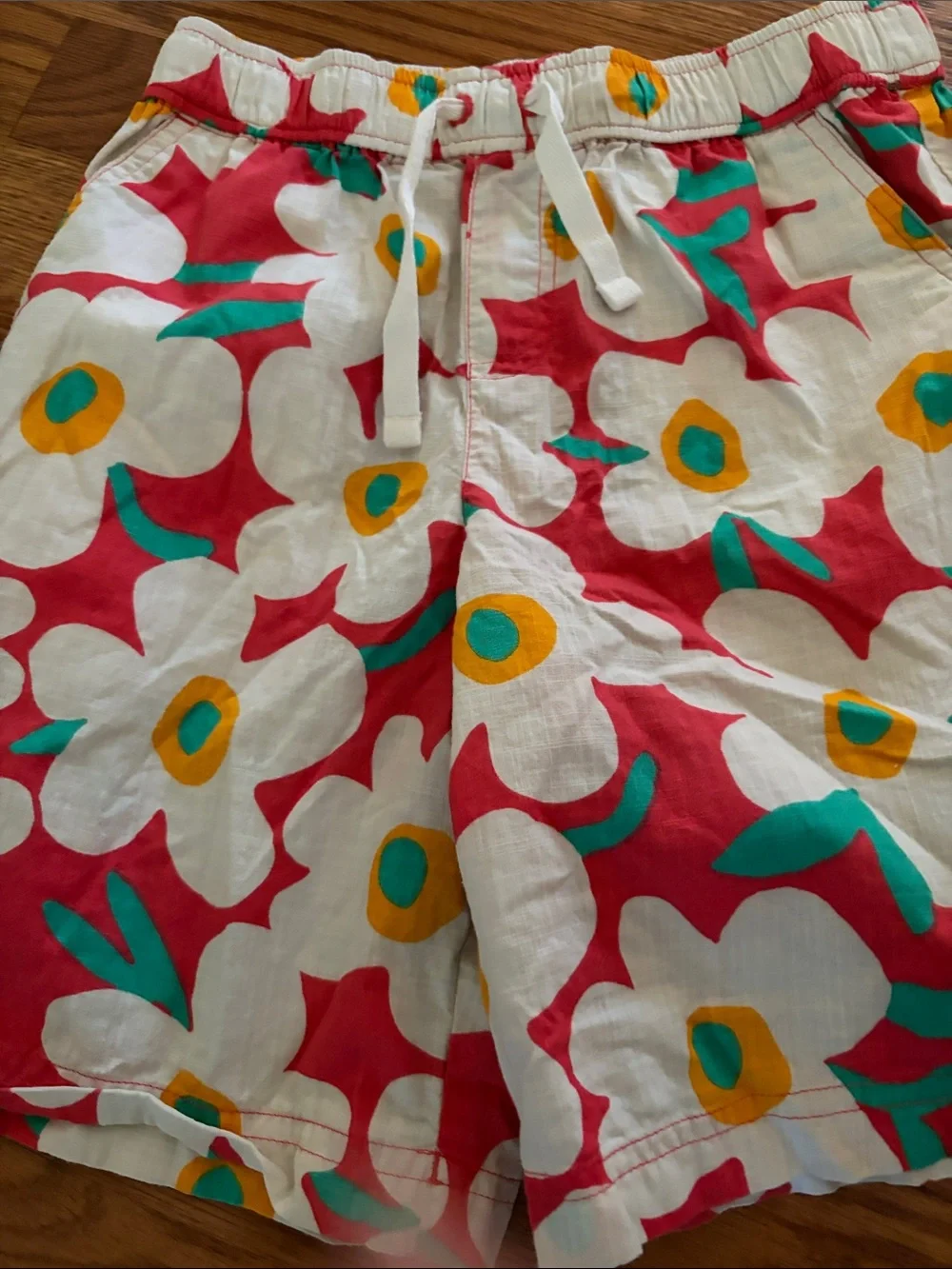 Hanna Andersson White Floral swim shorts with Red, Yellow & Teal Accents